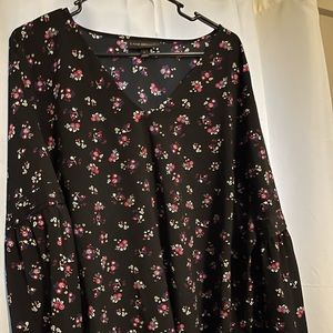 Black blouse with small blue/pink/white flowers